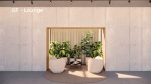 Loungehoek met twee ronde stoelen, een salontafel en veel groene planten in een nis aan de Fred. Roeskestraat.